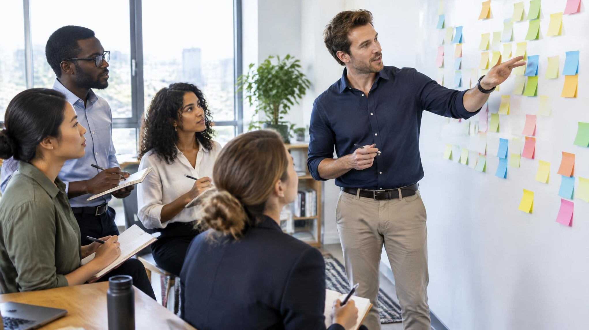 Consultant leading a workshop with sticky notes